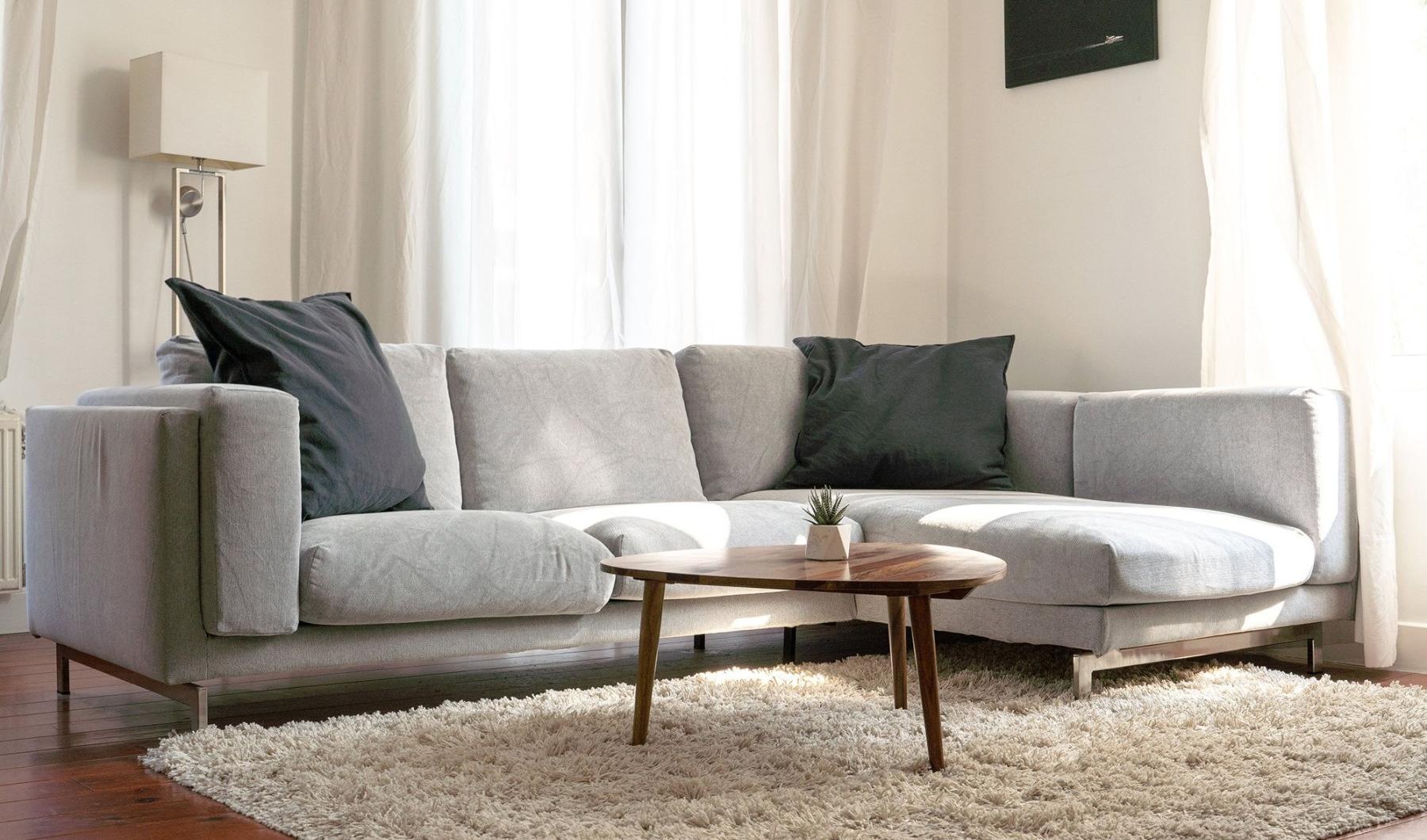 oversized windows brighten spacious, furnished living room